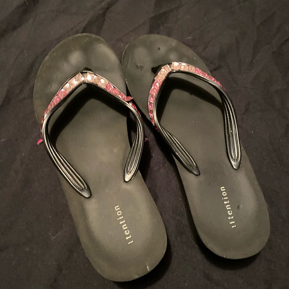 Pink jeweled flip flops